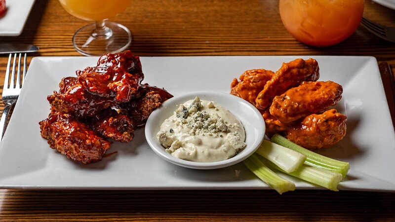 Chicken wings appetizer with ranch and celery sticks